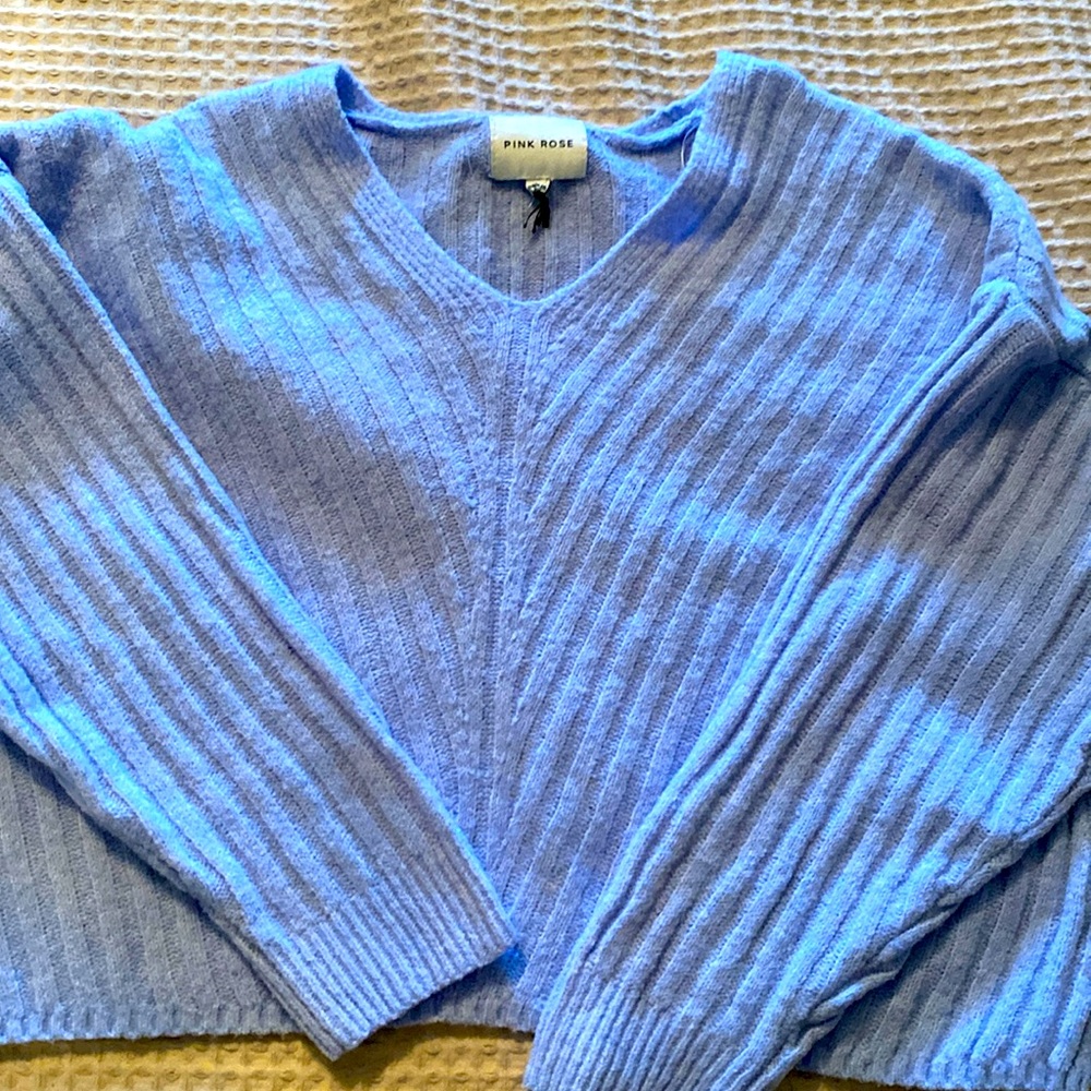 Baby blue sweater, size medium, good condition,